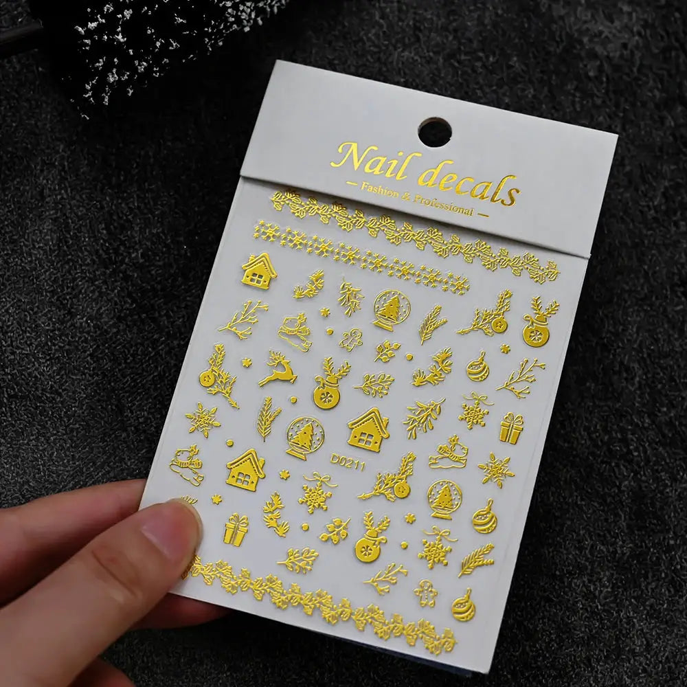 Nail decals: gold metallic self-adhesive winter Christmas stickers with snowflakes, houses and festive motifs.