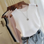White ribbed sleeveless O-neck blouse by Simples Market on a hanger with pastel tops in background