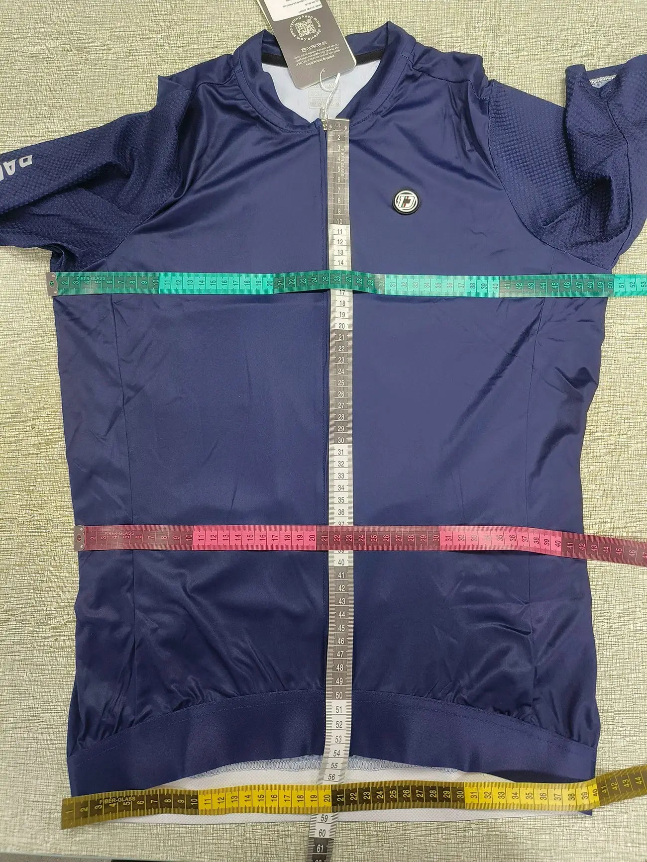 DAREVIE cycling jersey in navy blue with full-length zipper and circular logo badge.