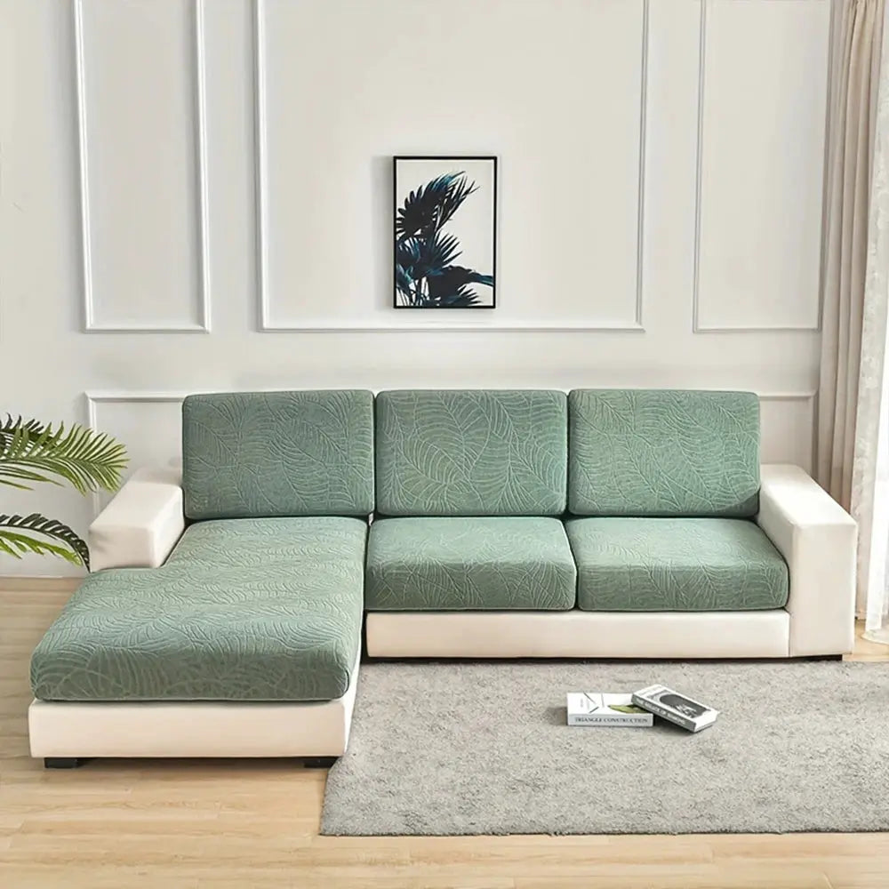 Waterproof stretch sofa cushion cover in teal jacquard leaf-pattern fabric for chaise lounge sofa