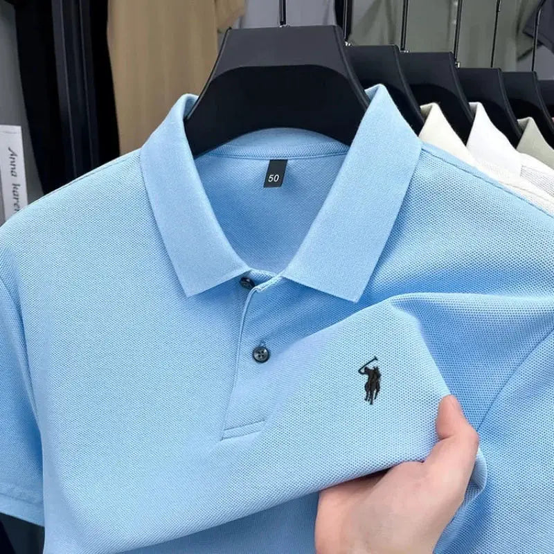 Polo shirt, Simples Market, light blue 100% cotton with black pony embroidery on chest; set of 5 on hangers.