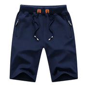 Men's navy blue shorts by Simples Market with drawstring waist and zip pockets, casual jogger style