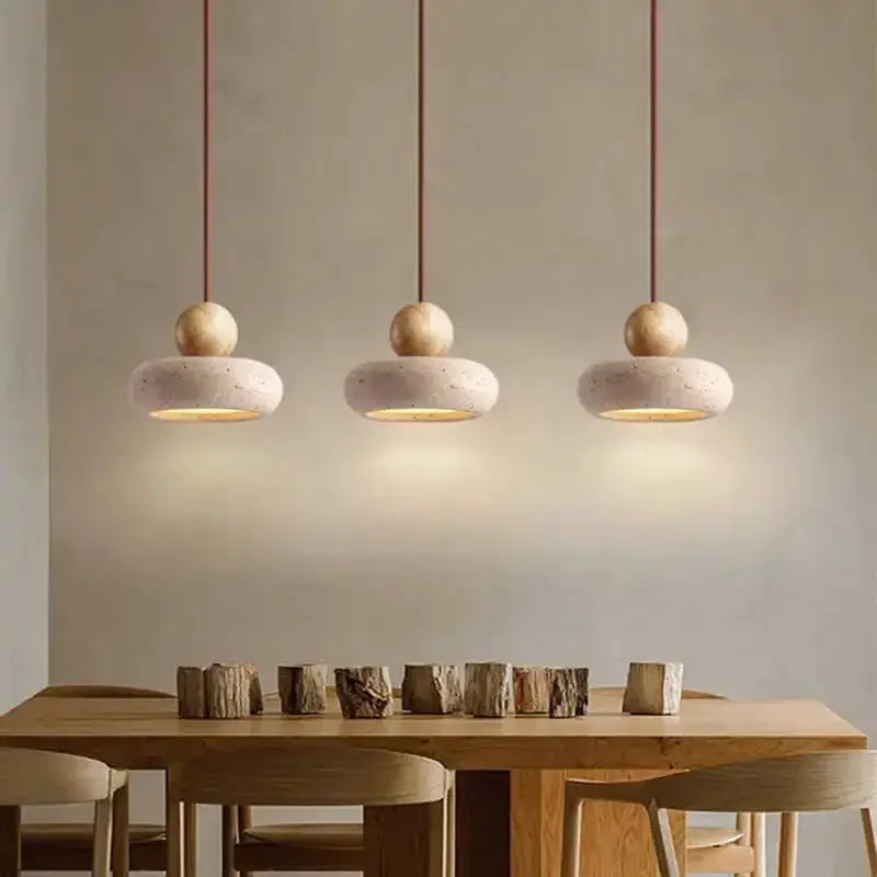 3 vintage pendant lights by Simples Market with natural yellow agate stones and cement bowls.