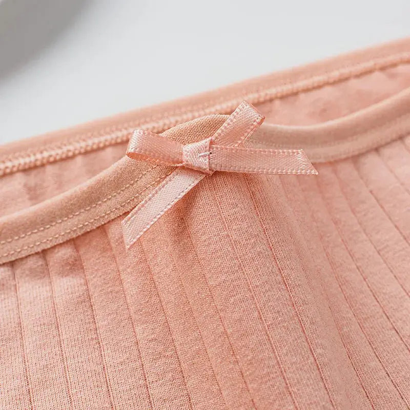 Women's pink cotton ribbed mid-rise panties with bow detail