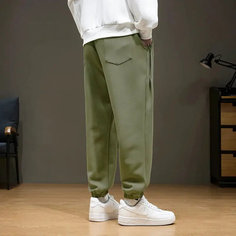 Men's olive green jogger sweatpants with back pocket and elastic cuffs