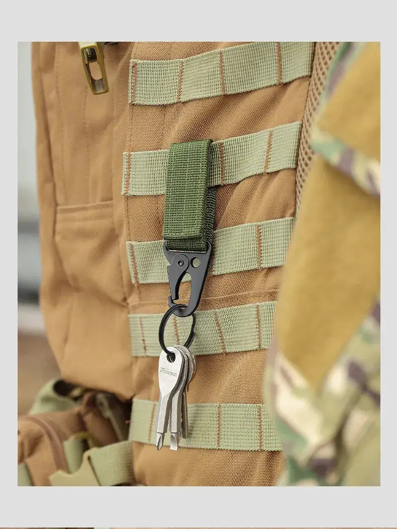 High-strength nylon carabiner key hook with MOLLE strap on tan tactical backpack, holding 3 keys