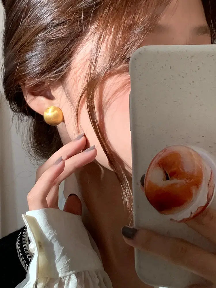 Semicircle earrings by Simples Market in gold brushed frosted metal for women