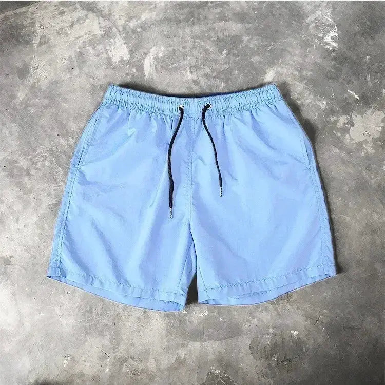 Men’s Swim Shorts by Simples Market, 2024 Summer, light blue with elastic waistband and black drawstring