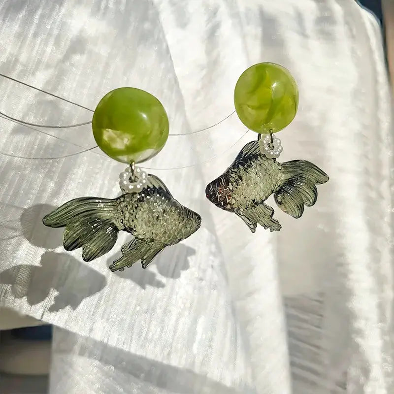 Goldfish drop earrings with transparent koi pendants and lime-green round beads at the top
