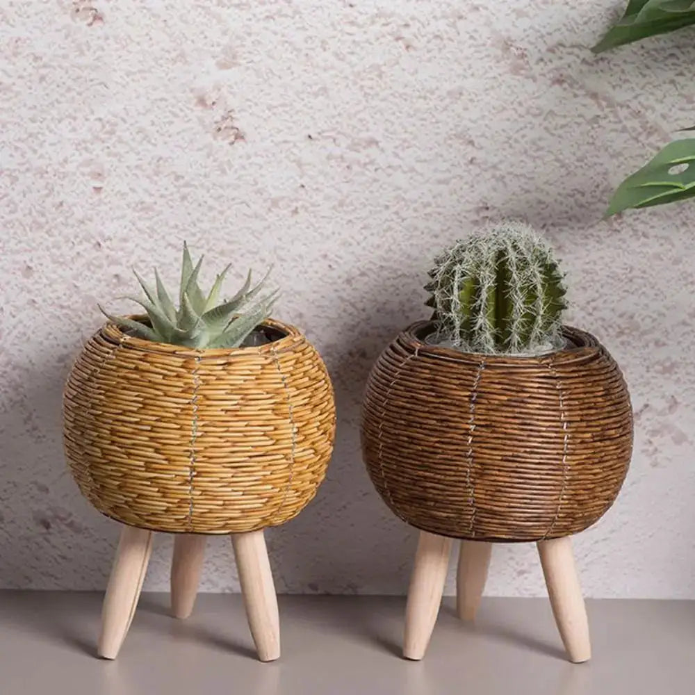 Simples Market rattan woven flower pots with removable legs, set of 2 in light tan and dark brown, each on wooden legs.