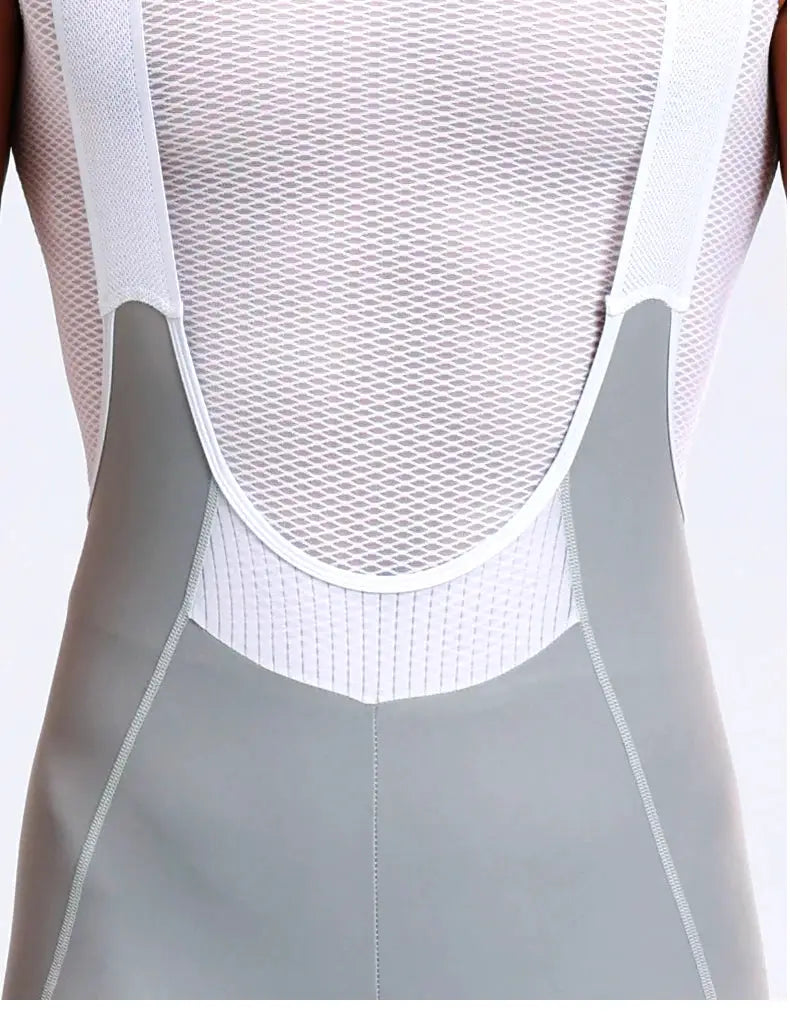 Men's cycling bib shorts with high waist and breathable white mesh back, gray panel accents