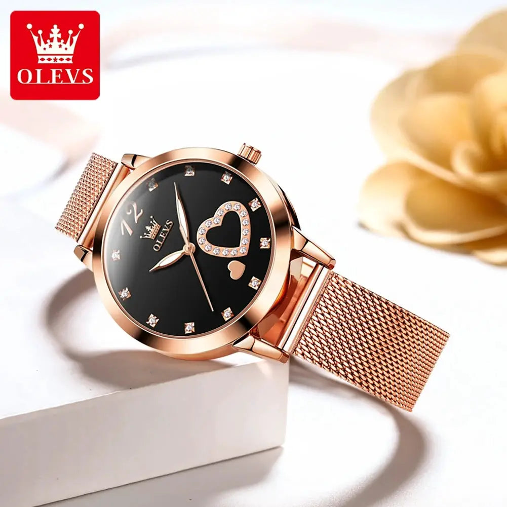 OLEVS women's quartz watch with rose-gold mesh strap, black dial featuring a crystal heart design