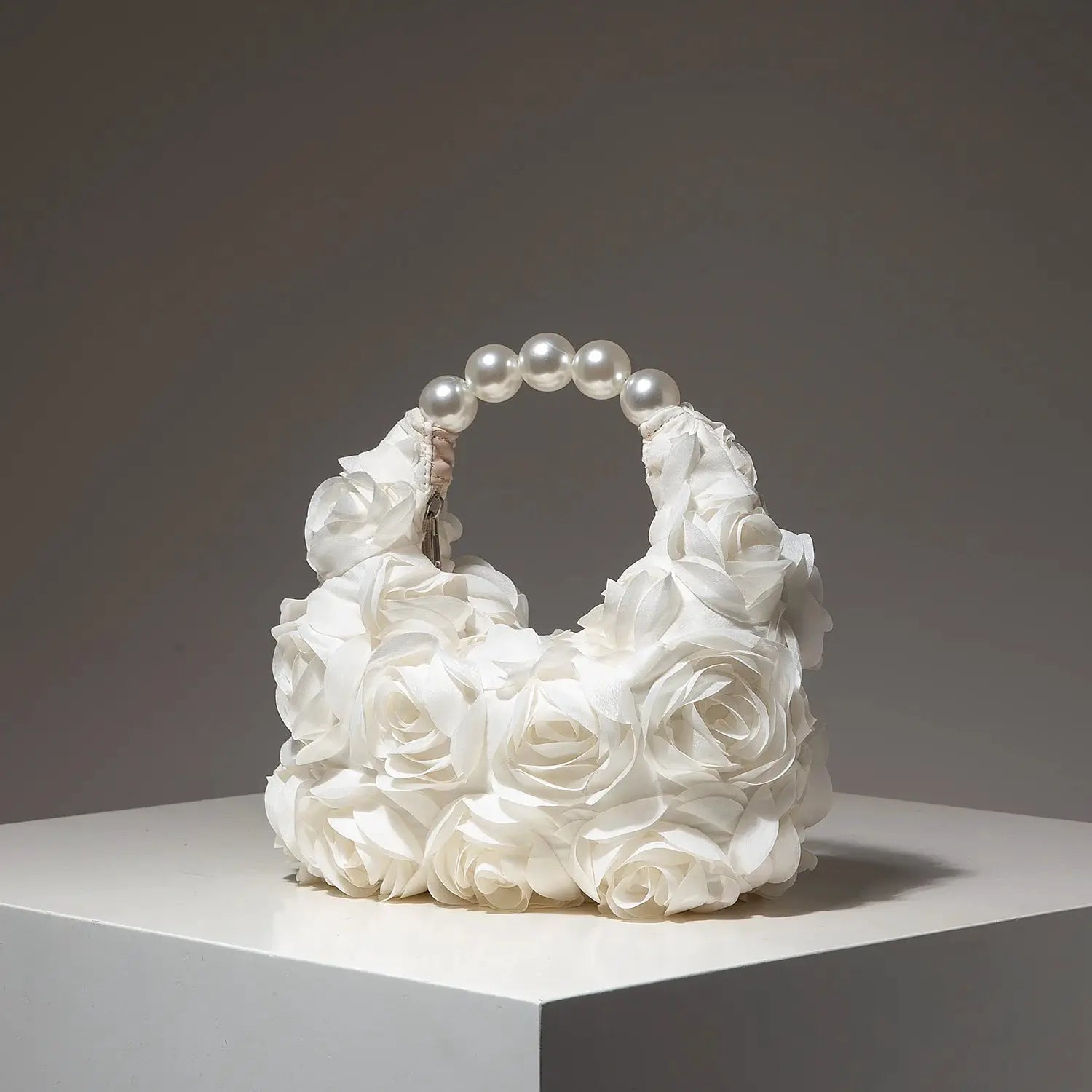 Pearl-bead clutch with white floral rosette fabric by Simples Market