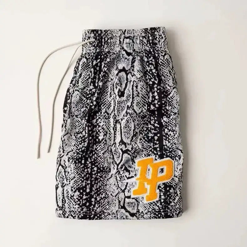 Men's snake-print shorts with drawstring, breathable quick-dry fabric, yellow NP patch.