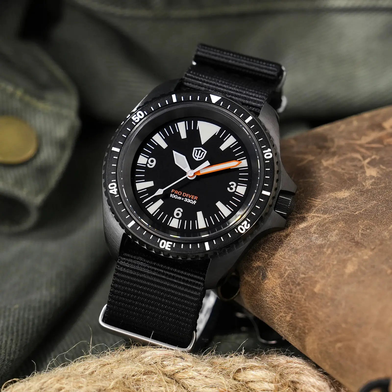 Watchdives WD1980 V3 diver's watch on black NATO strap; black dial with white markers and orange-tipped hand.