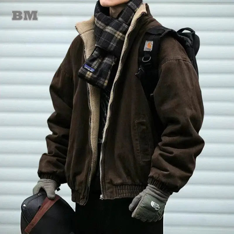 Men's brown polar fleece jacket with cream sherpa lining, paired with plaid scarf and backpack