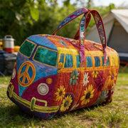 Quilted duffle bag with bright multicolor vintage camper print; top handles by Simples Market