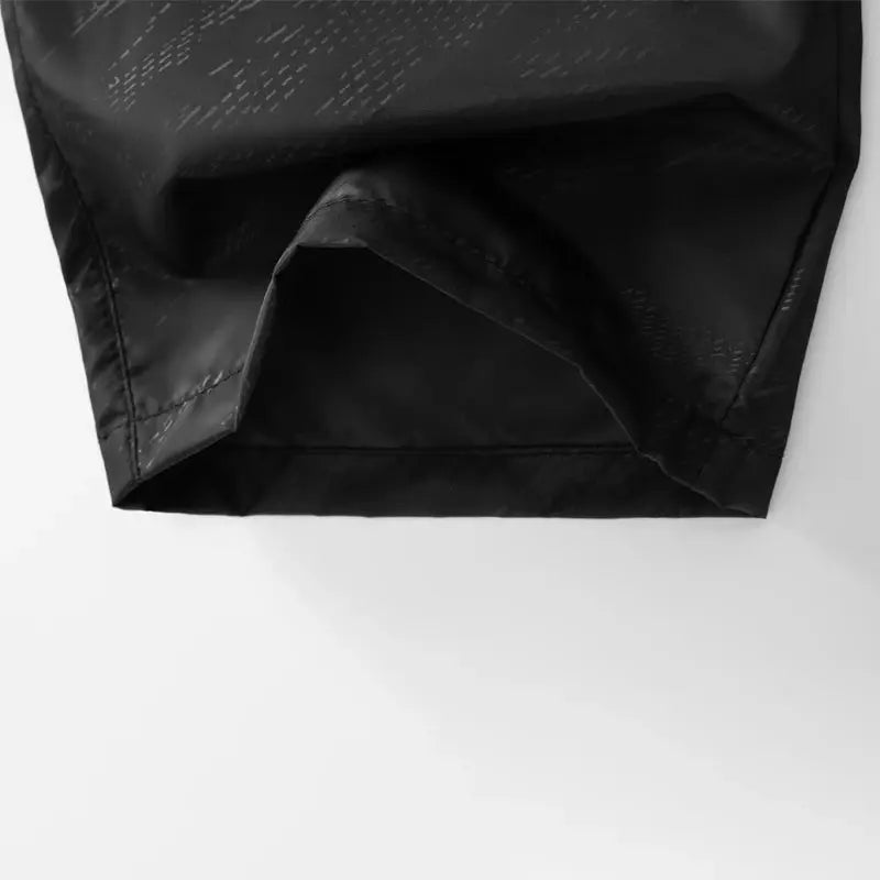 LNGXO waterproof hiking pants, black unisex outdoor trousers with folded cuff hem.