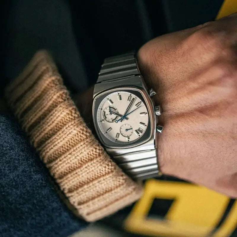 CILOA men's vintage stainless steel automatic wristwatch with silver dial and bracelet.