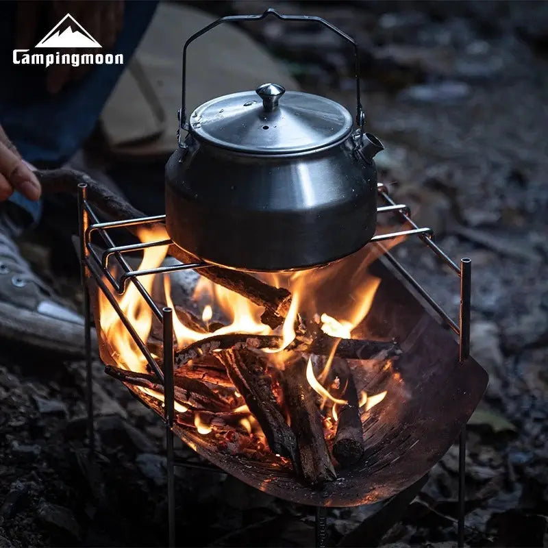 Campingmoon SOLO-A4 stainless steel portable folding BBQ grill with kettle over campfire