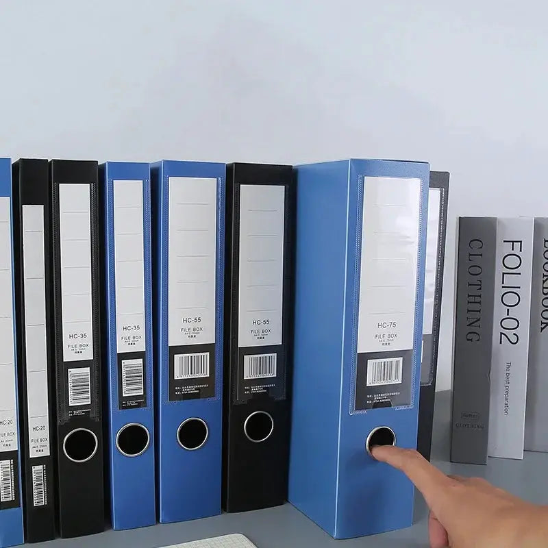 Blue A4 plastic file storage box with lid, 3in thick, folded-folder organizer on a shelf with blue and black file boxes