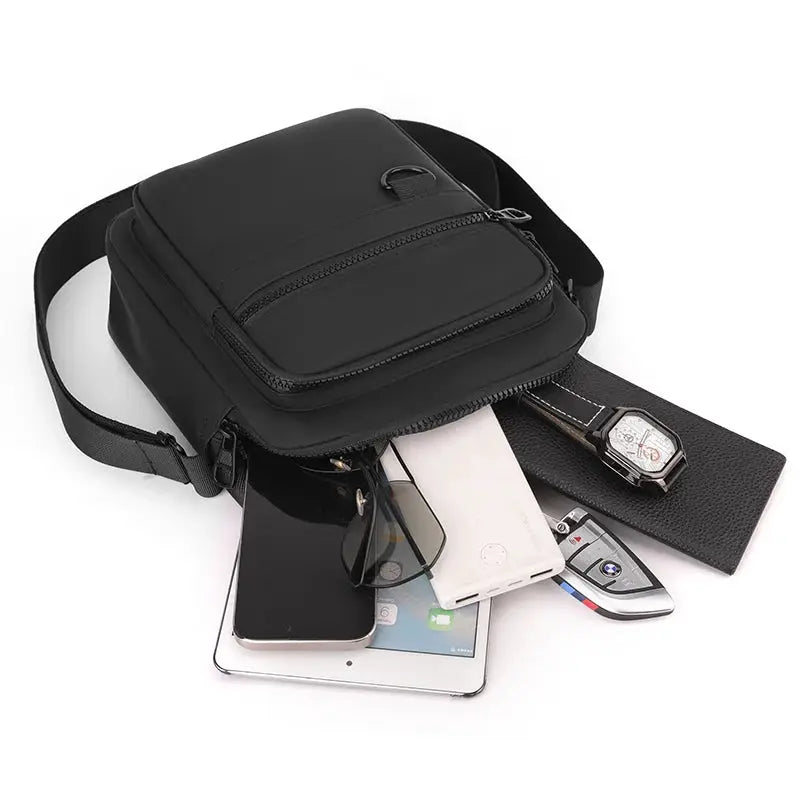 Men's black Oxford messenger sling bag with zippered pockets