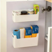 White cabinet-door organiser with two non perforated racks holding spice jars, boxes, and a blue paper towel roll