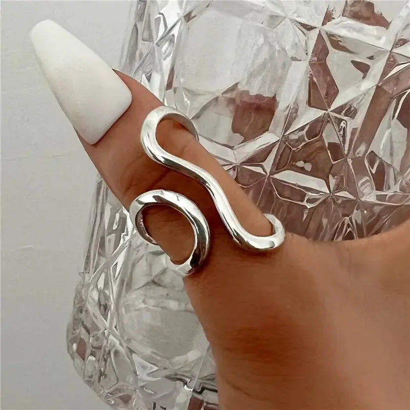 Unisex irregular stainless steel ring with an S-shaped curve in silver-tone finish