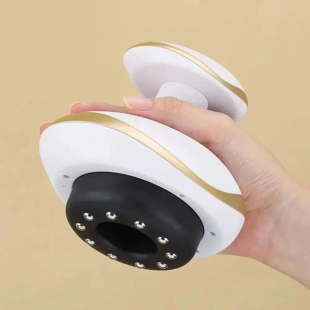 Electric cupping massager with white body, gold trim, and black multi-hole suction cup, held in hand.