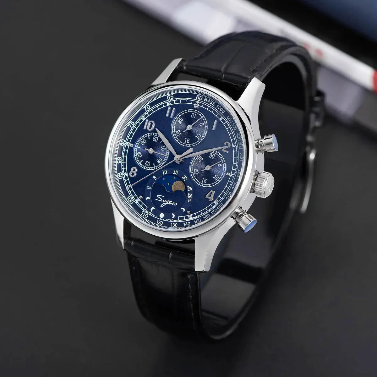 Sugess men’s blue dial chronograph watch with moonphase, stainless steel case, black leather strap