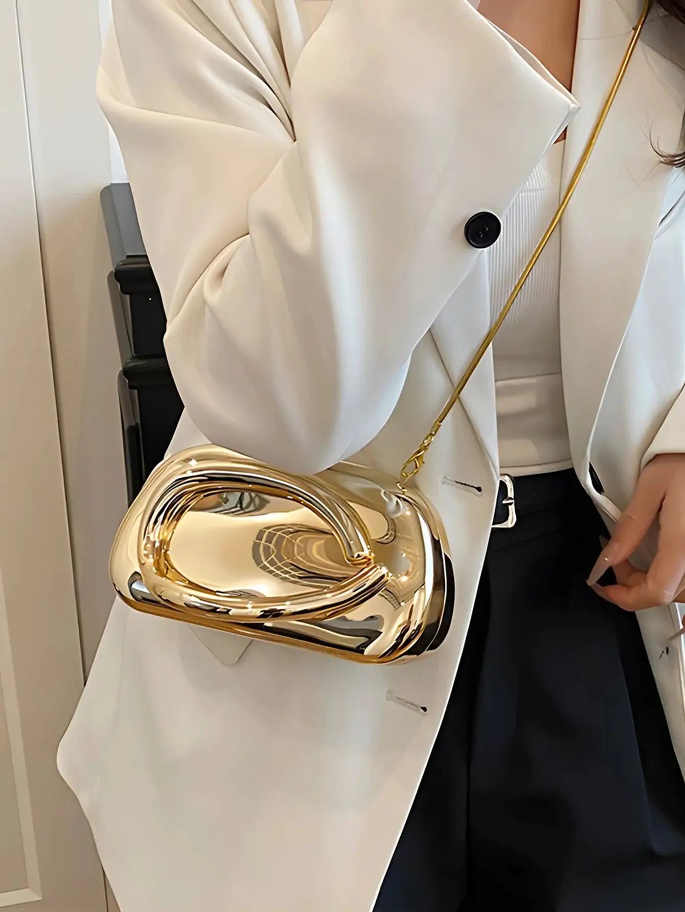 Gold acrylic box-shaped clutch with chain strap; elegant evening crossbody bag