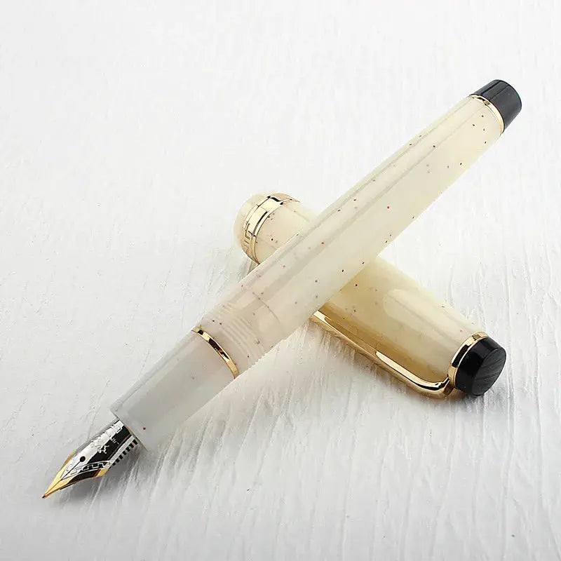 Jinhao 82 fountain pen in ivory speckled acrylic with gold trim and bent nib, converter included