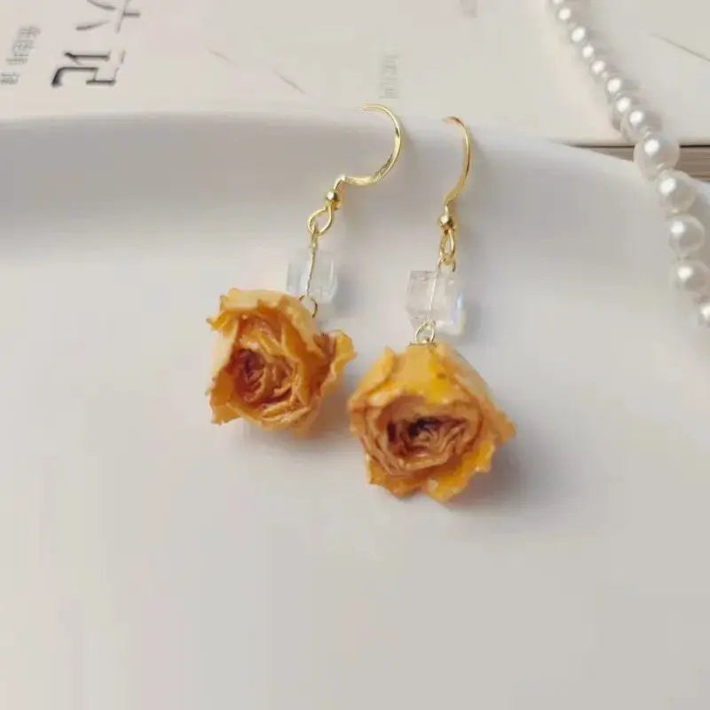 Red rose epoxy resin drop earrings with clear beads and gold-tone hooks