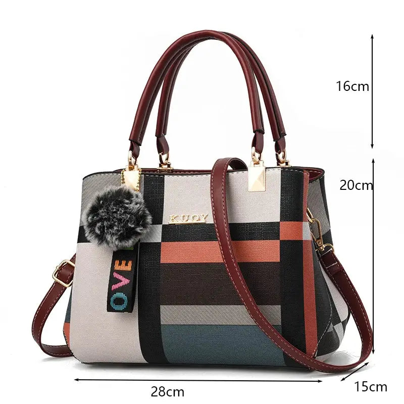 PU leather crossbody bag for women with multicolor plaid pattern, maroon handles, and gold hardware.