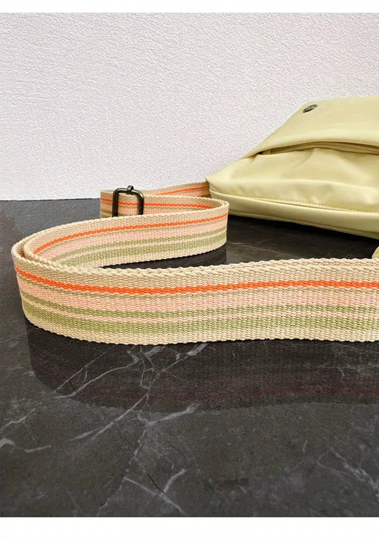Simples Market ultra-light nylon crossbody bag with adjustable wide striped strap in peach, green, and cream.