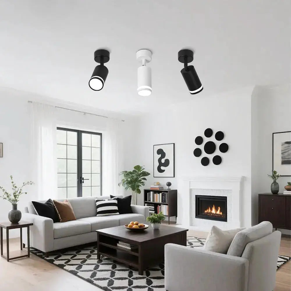 Set of 3 LED ceiling spot lights in black and white with GU10 bulbs, mounted in a bright living room