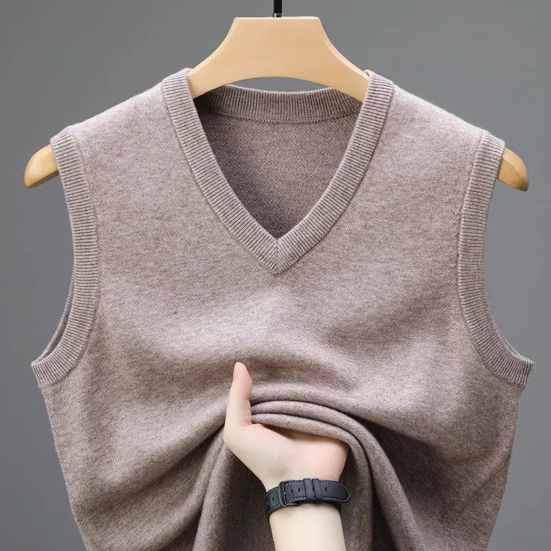 Men's beige knit sweater vest with V-neck, sleeveless.