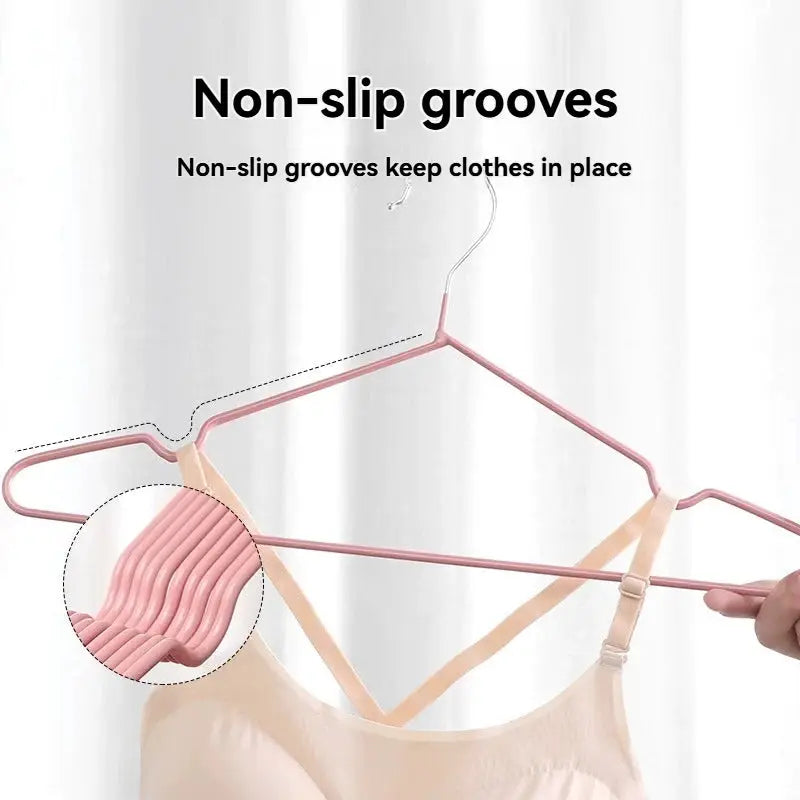 Pink metal multi-functional anti-slip clothes hanger with grooved grip for secure wardrobe use