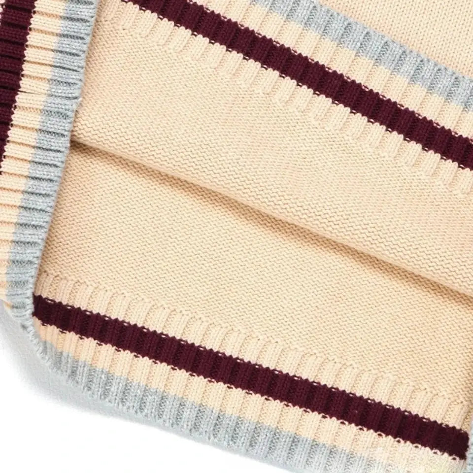 Beige striped knit sweater vest for men with burgundy and gray stripes; sleeveless V-neck