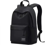 Backpack, black, minimalist with front zip pocket and top handle.
