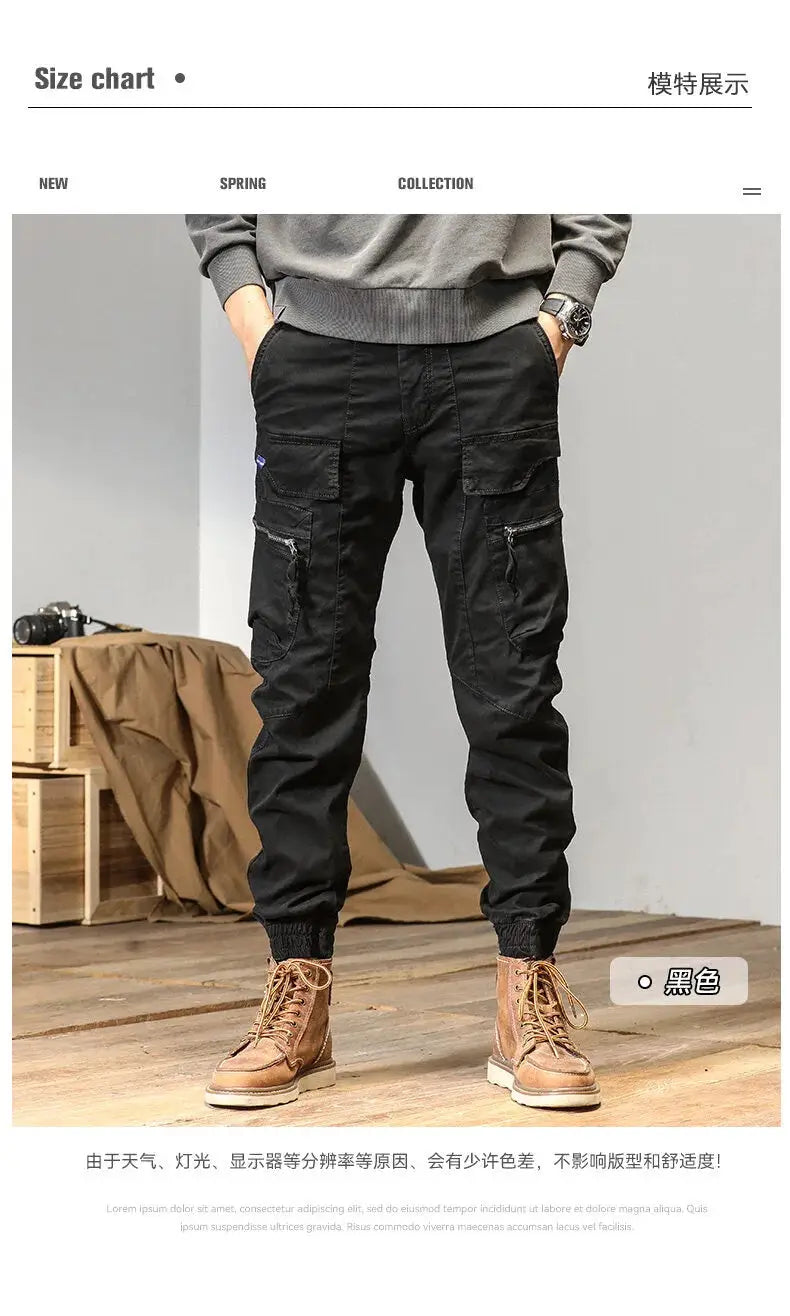CAAYU men's cargo joggers in black with multiple pockets, zippered compartments, and tapered cuffs.