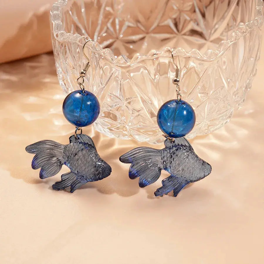 Goldfish pendant earrings; pair featuring blue glass beads and translucent fish charms