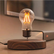 Magnetic Levitation Lamp by Simples Market with a floating glass LED bulb above a wooden base