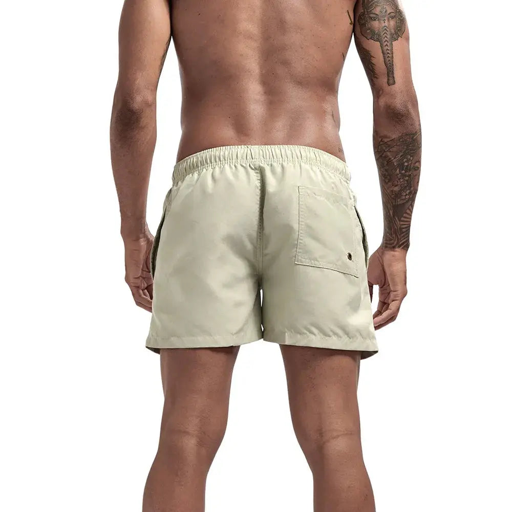 Men's beige quick-dry swim trunks with back pocket and elastic waistband