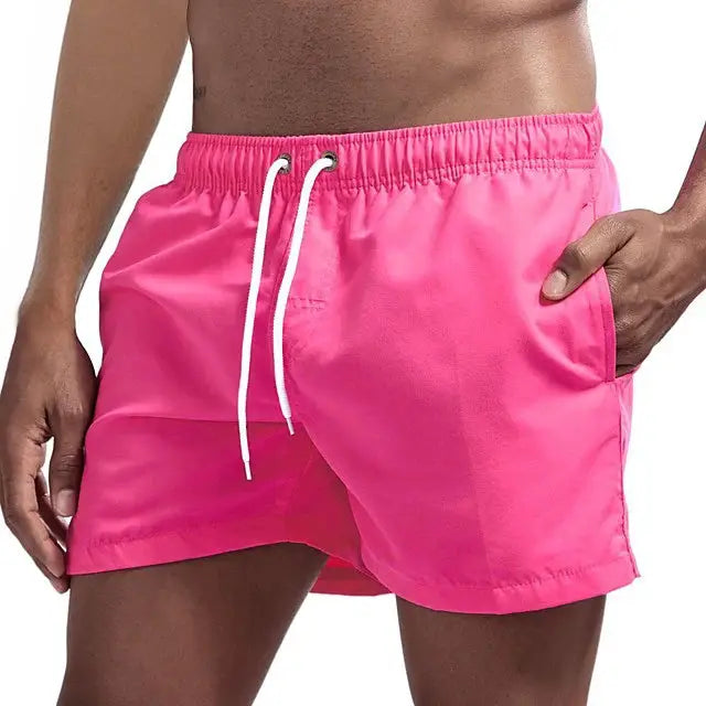 Men's pink quick-dry swim shorts with white drawstring and pockets