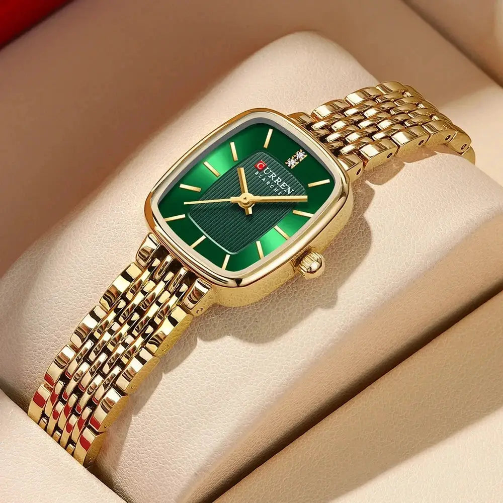 CURRN women's quartz watch in gold-tone with green dial, diamond accents, and gold stainless-steel band