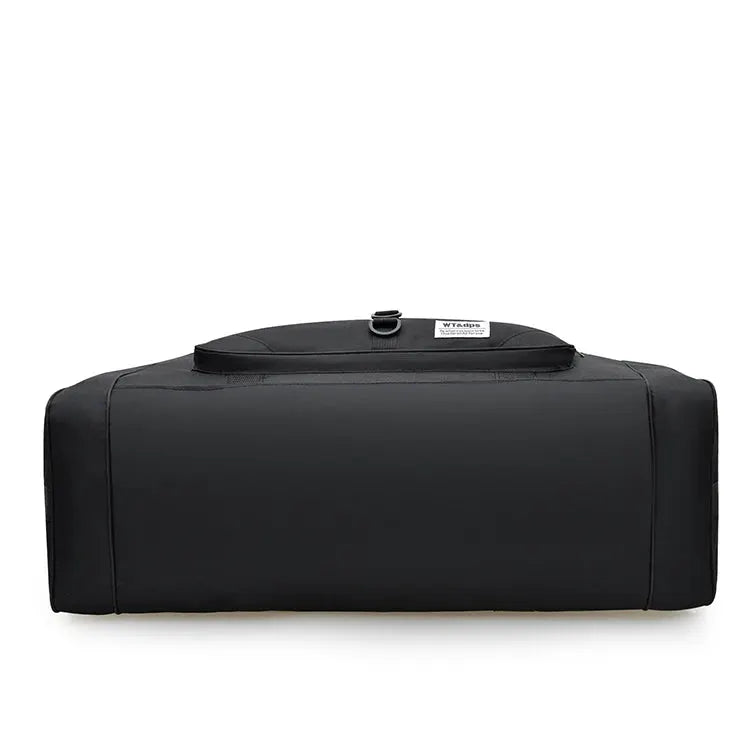 Oversized handbag by Simples Market; black nylon duffel for travel, fitness, and outdoor use.
