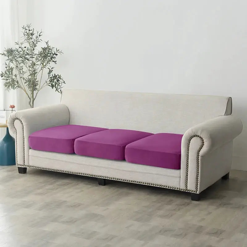 Plush sofa slipcover by Simples Market on beige sofa with three purple cushions