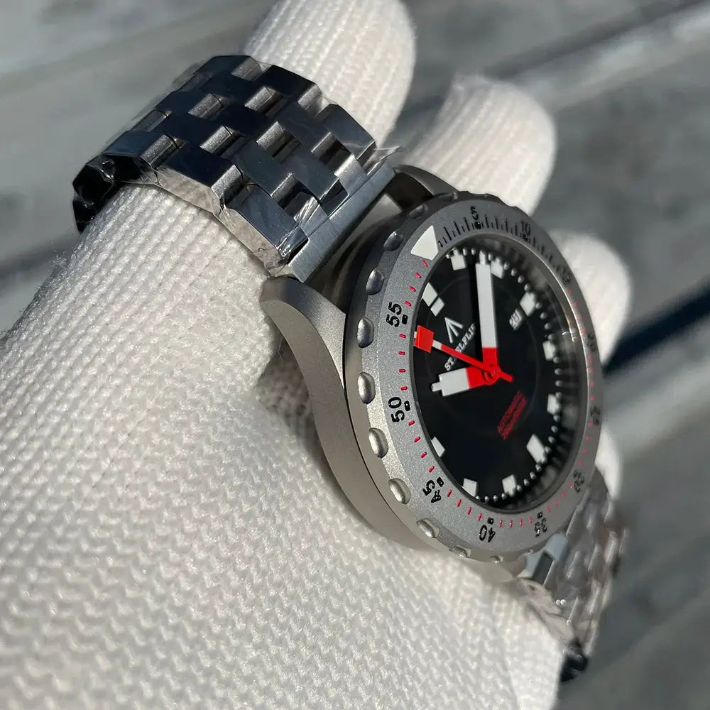 STEELFLIER SF752 dive watch with stainless steel bracelet, black dial, white markers, red hands, and rotating bezel