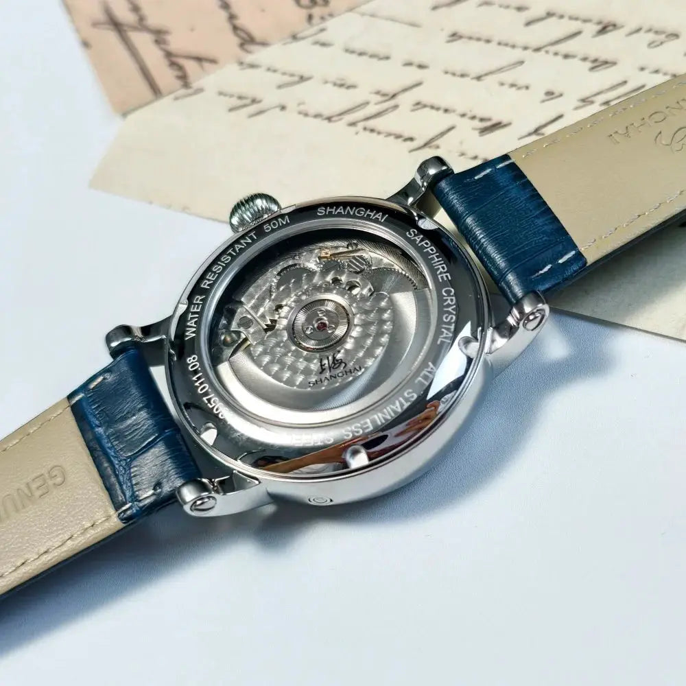 Shanghai Watch 42mm automatic mechanical timepiece with sapphire crystal, stainless steel case, and blue leather strap